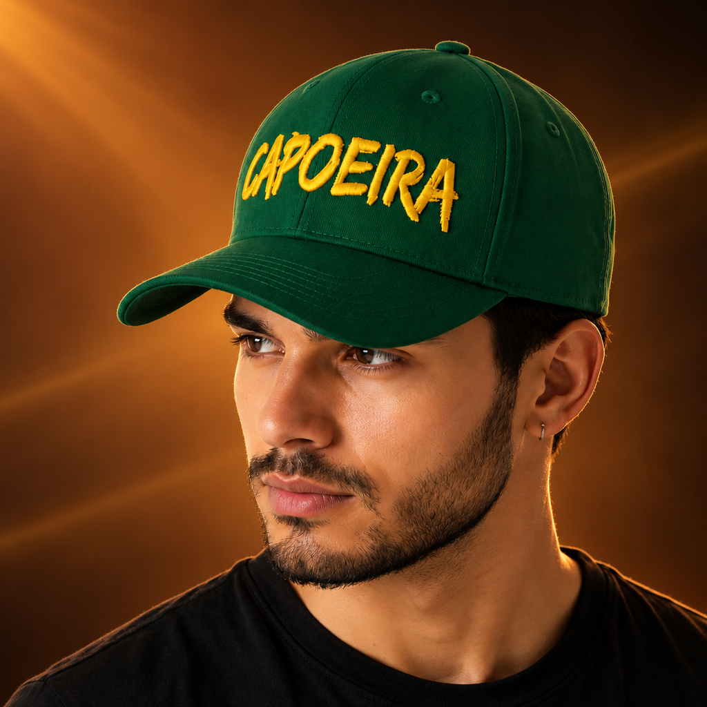 Modelo com boné Capoeira verde e bordado dourado, capa editorial Capoeira in Motion