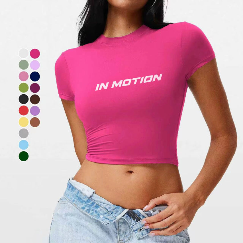 Model wearing the pink In Motion fitted crop top