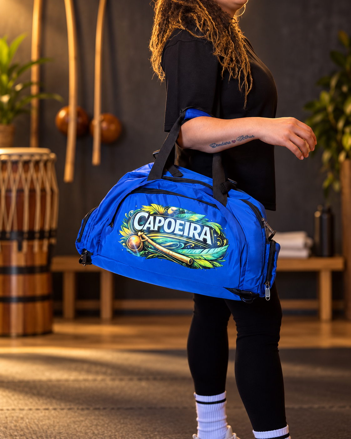 Blue Capoeira sports bag carried by model